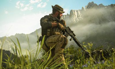 Un soldato in mezzo al fogliame con un fucile in Call of Duty: Modern Warfare 3.