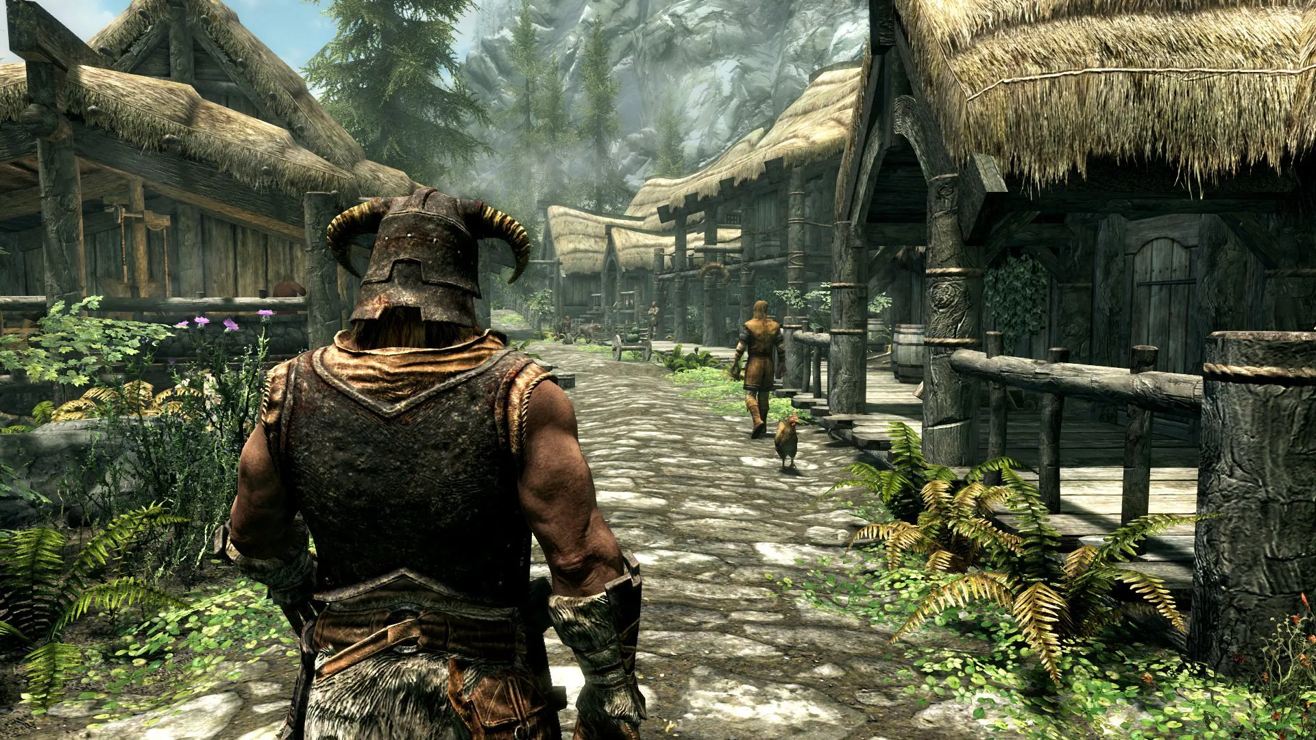 Armored warrior walking through a medieval village in PC game