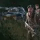 Soldiers and tank advancing through forest in strategy game of 2024