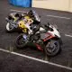 Two motorcyclists race side-by-side on a track in Steam's best racing game