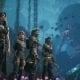 Underwater party scene with four heroes and a giant creature in a Game Pass RPG