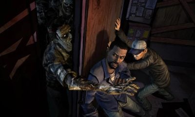 Two characters barricade a door against zombies in horror mobile game