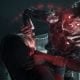 A man is attacked by a glowing-eyed mutated humanoid in PS Plus horror game