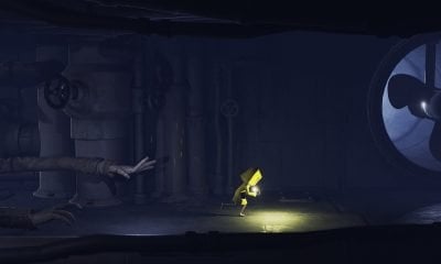 Child in yellow raincoat runs from long hands in a Play Pass game