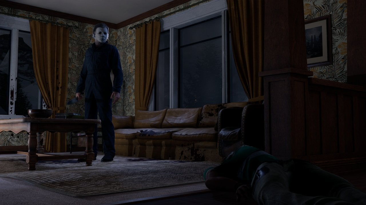 The killer holds a knife inside a dark living room
