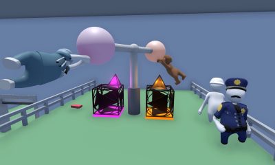 Cartoon-like characters hang from glowing orbs while others watch in a playful physics-based Game Pass puzzle game scene