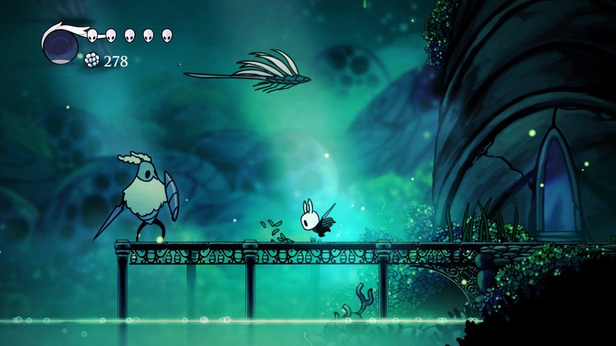 Small masked character with a nail weapon faces a larger armored enemy on a bridge in a Metroidvania game