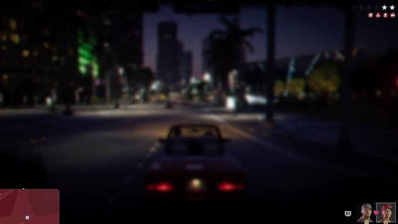 Night driving scene shows a blurred city chase with multiple wanted stars active