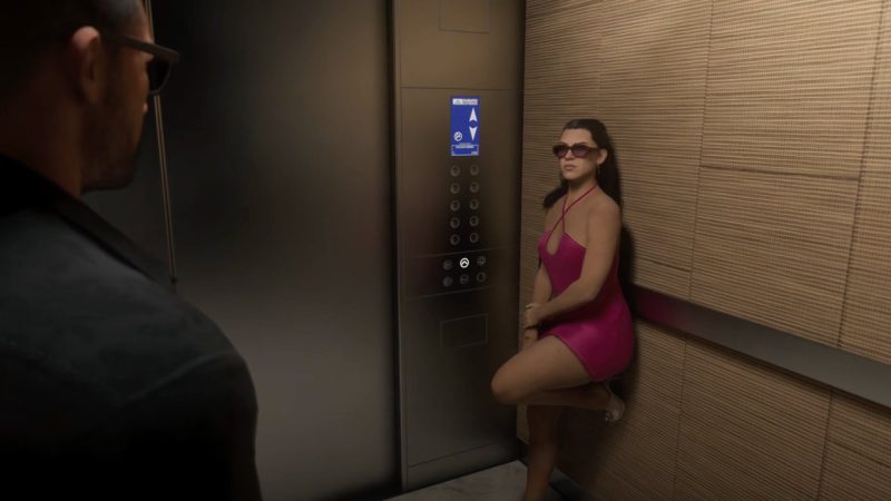Woman in a pink dress stands inside an elevator beside another character