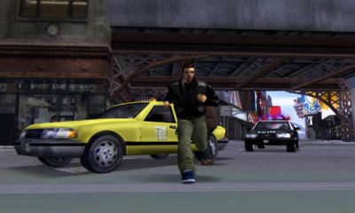PS2 game scene showing a man running past yellow taxi and police car
