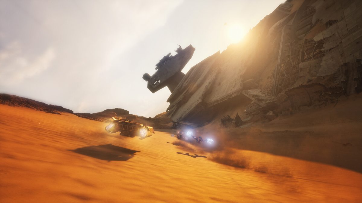 Two racing vehicles speed across orange desert sand beside a massive wrecked starship in Star Wars: Galactic Racer.