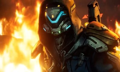 An armored Borderlands character stands against a background of orange flames.