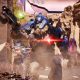 An armored alien charges through a rocky battlefield in Halo: Campaign Evolved.
