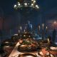 Candlelight falls across a decaying banquet table in Dying Light: The Beast.
