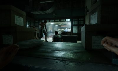 A figure sits in a dim observation room in The Outlast Trials.
