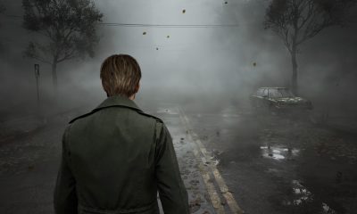 James Sunderland looks toward a fog-covered lake in Silent Hill 2.