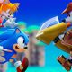 Sonic, Tails, Knuckles, and other Sonic characters gather against a bright blue sky.