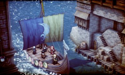 A small party stands on stone platforms beside colorful hanging banners in a tactical fantasy setting.