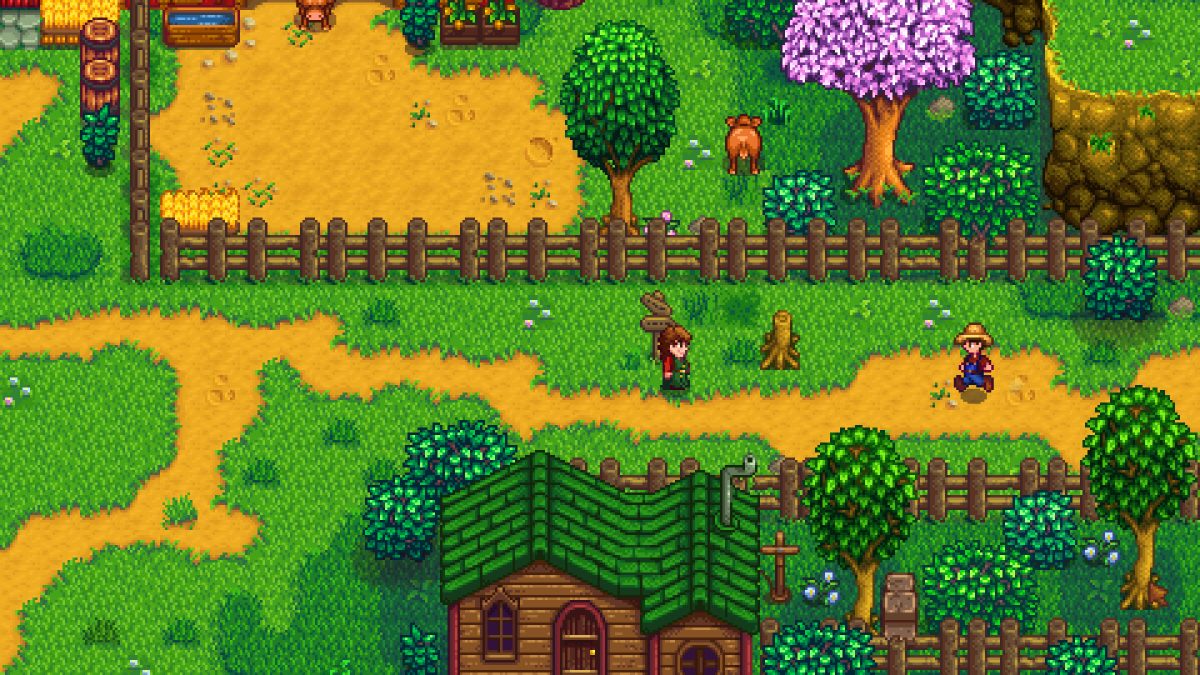 A farmer walks through a colorful village square in Stardew Valley.