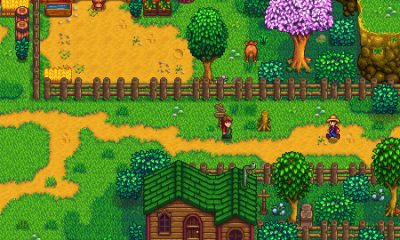 A farmer walks through a colorful village square in Stardew Valley.
