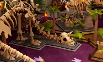 Dinosaur skeletons fill an exhibition hall in Two Point Museum.