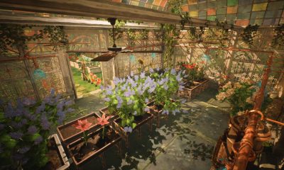 Flower beds and leafy plants fill a sunlit greenhouse in Garden Life: A Cozy Simulator.