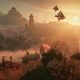 A winged creature flies above a sunlit valley and ancient ruins in Enshrouded.