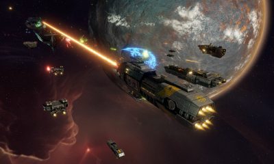 A large spacecraft fires its engines above a planet in Sins of a Solar Empire II.