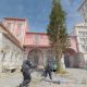 Counter-Strike 2 characters moving through a sunlit courtyard.