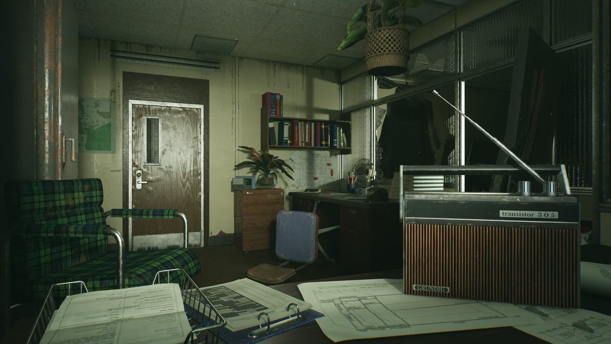 Dimly lit office with a radio and deep shadows in Still Wakes the Deep.
