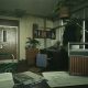 Dimly lit office with a radio and deep shadows in Still Wakes the Deep.