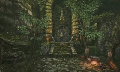 Stone steps leading to an overgrown ruined entrance beside a campfire in Queen’s Domain.